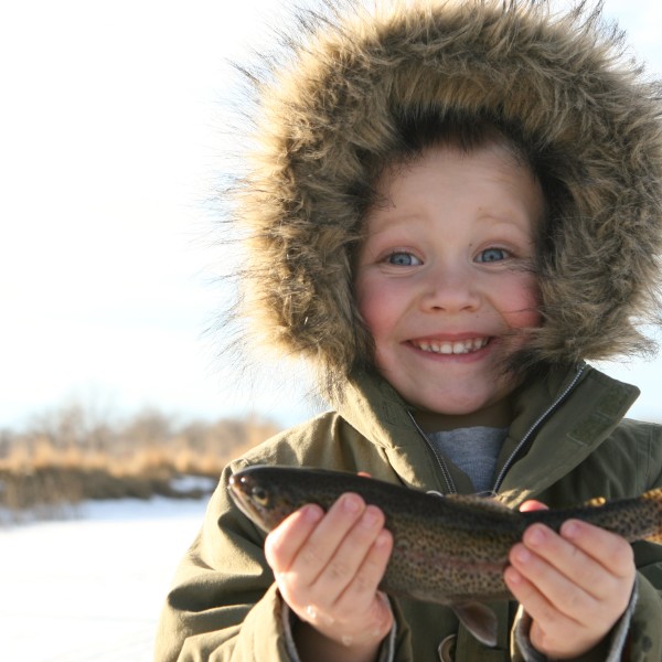 Activity - little boy smiling with a fish