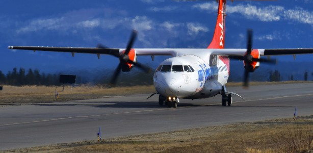 Air North plane landing on the runway
