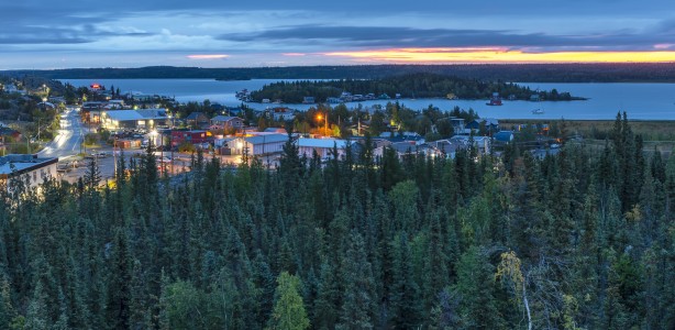 Landscape views of Yellowknife at sunrise abundant with evergreen trees