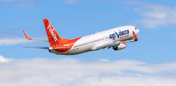 Air North Boeing 737-800 climbing into a blue sky