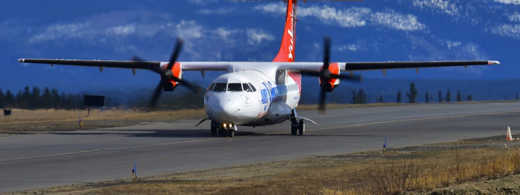 Air North plane landing on the runway