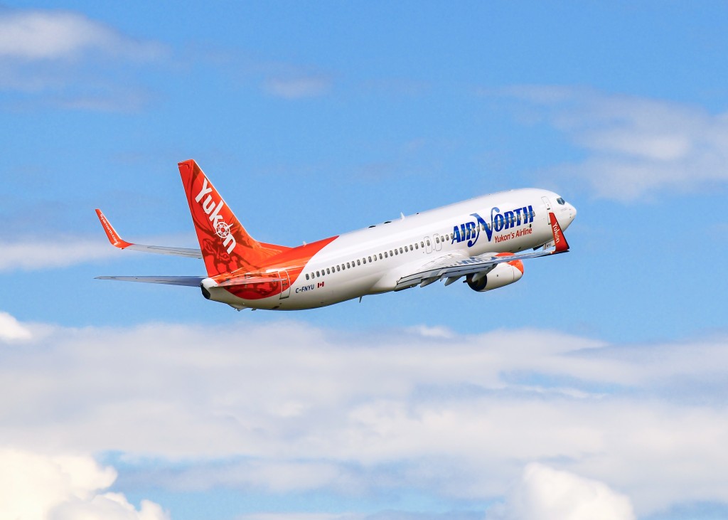 Air North Boeing 737-800 climbing into a blue sky
